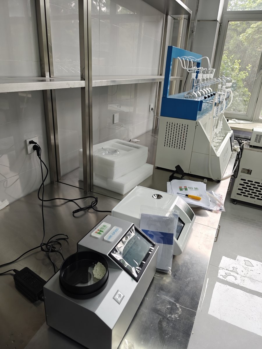 Close-up of HM-GP200 NIR grain analyzer sample port on stainless steel bench