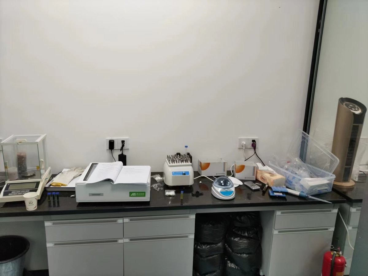 Rice freshness meters and supporting lab instruments on bench at grain reserve