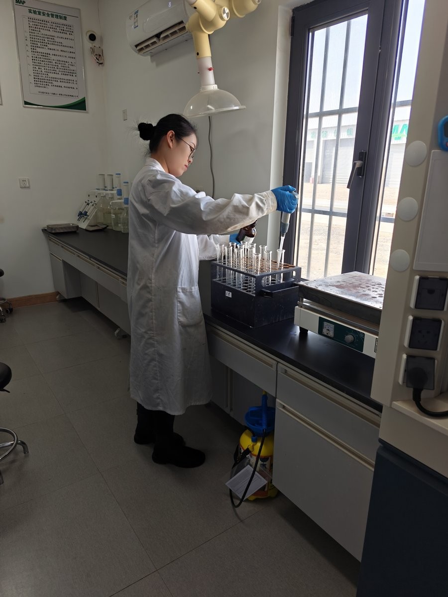 MAP laboratory technician practising pipette transfer during HM-GT4 operator training