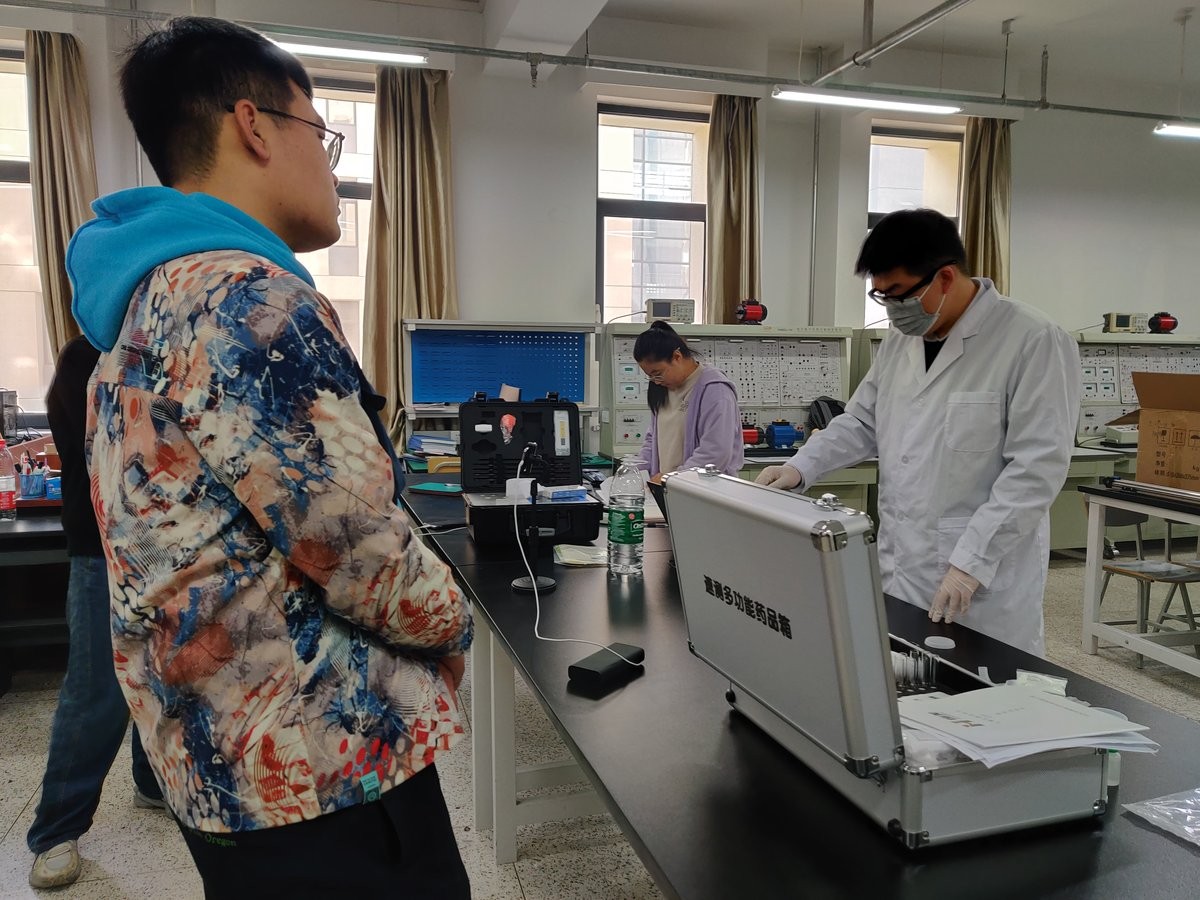 Trainee operating a plant parameter instrument during university training