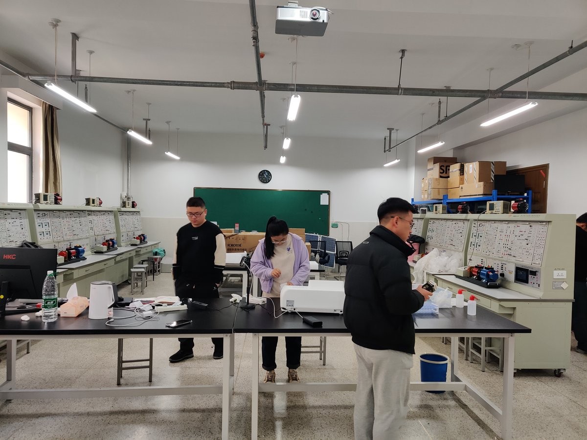 Wide shot of the university laboratory training with multiple instrument stations in use