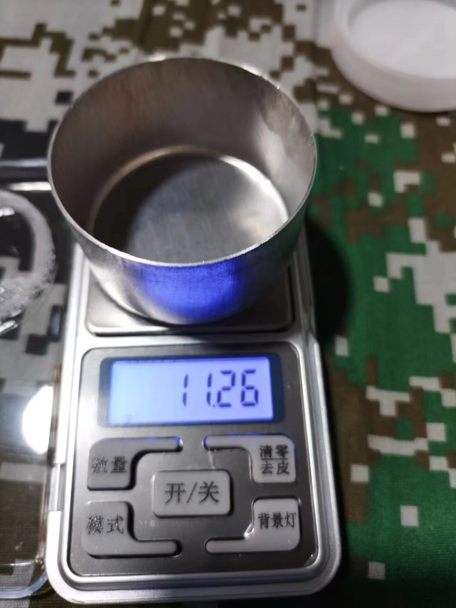 Digital balance displaying 11.26 grams during soil sample weighing for HM-GT4 analysis at Xuechuan Agriculture Group