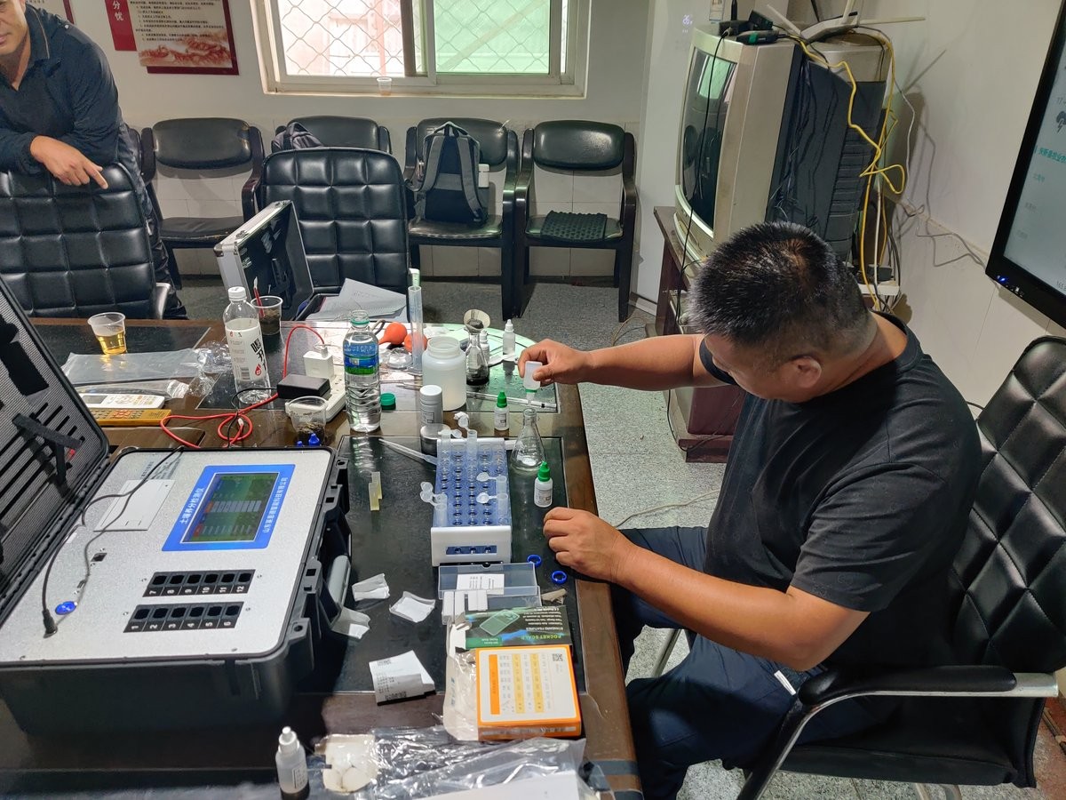 Operator preparing soil reagent solution during HM-GT2 hands-on training