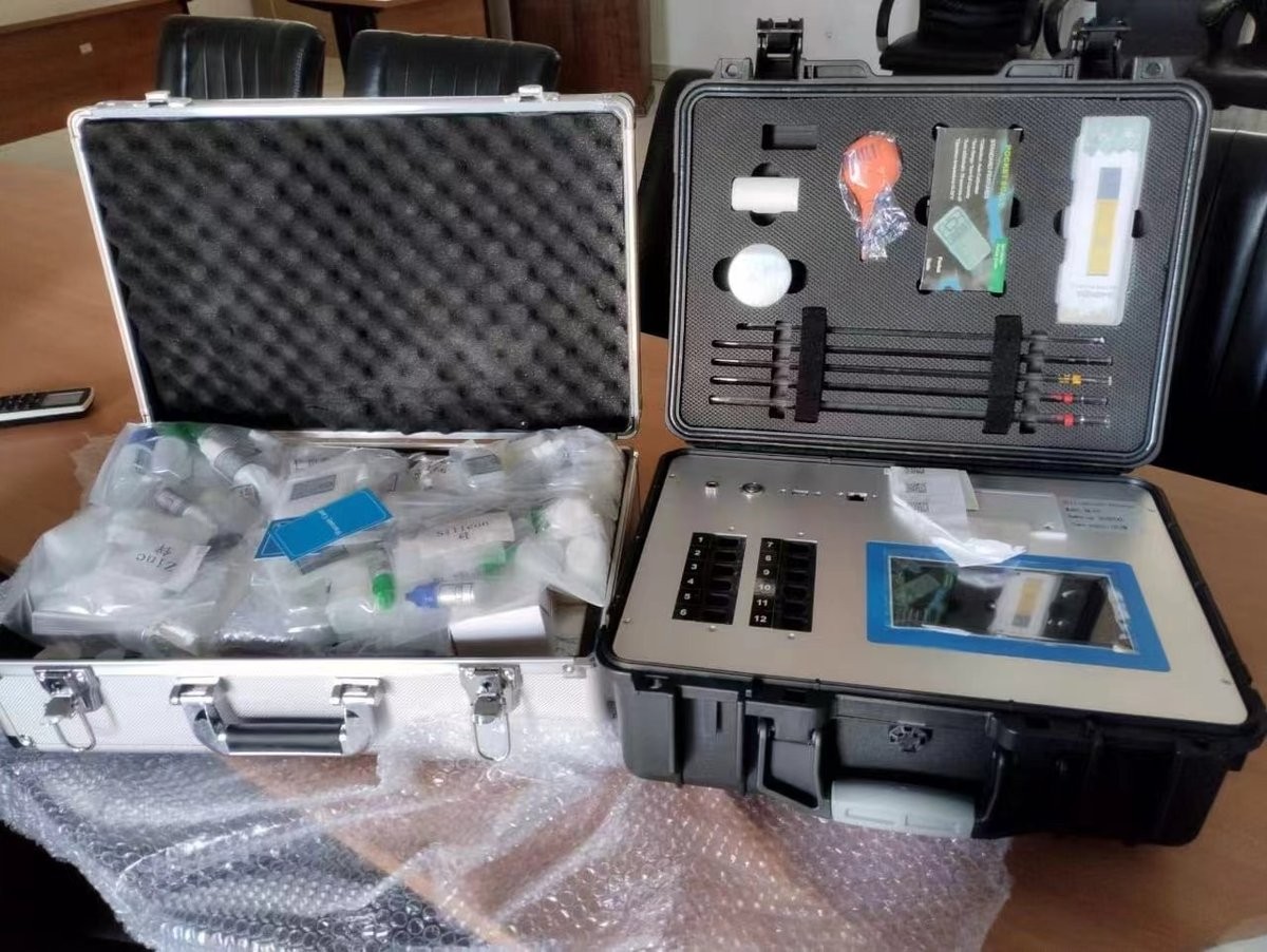 HM-GT5 soil nutrient analyzer and reagent kit cases opened for inspection